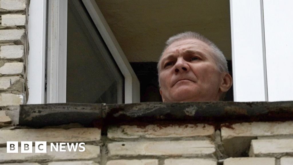 Russian whose daughter drew anti-war picture flees jail term
