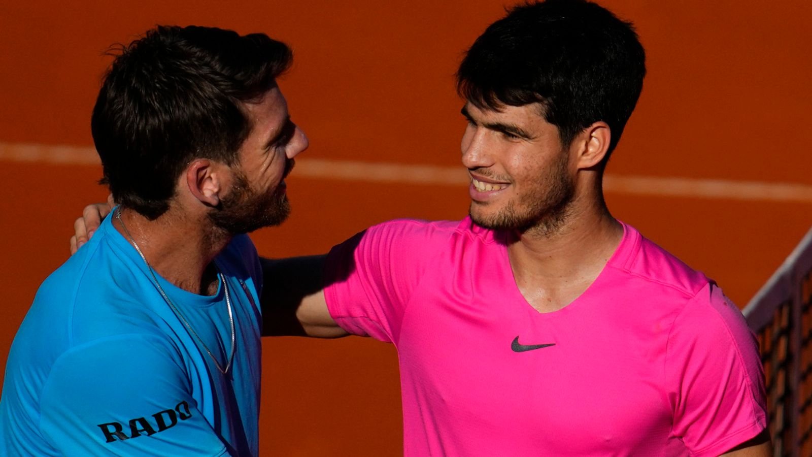 Carlos Alcaraz of Spain, right, greets Cameron Norrie of Britain, after winning the final match of the Argentina Open ATP in Buenos Aires, Argentina, Sunday, Feb. 19, 2023. (AP Photo/Natacha Pisarenko)