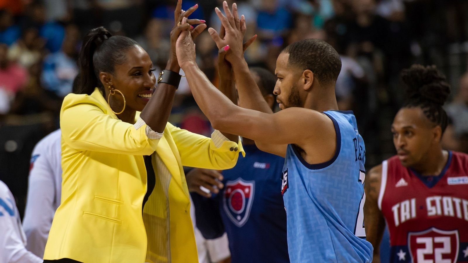 Triplets head coach Lisa Leslie celebrates with Triplets player Jannero Pargo.