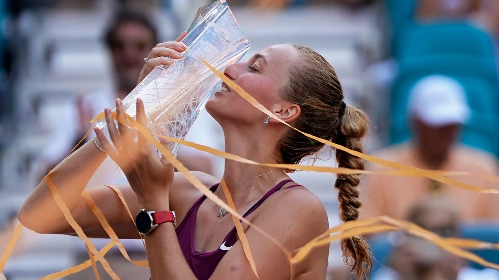 Petra Kvitova, of the Czech Republic, kisses her trophy after she beat Elena Rybakina, of Kazakhstan, during the women's singles finals of the Miami Open tennis tournament, Saturday, April 1, 2023, in Miami Gardens, Fla. (AP Photo/Wilfredo Lee)