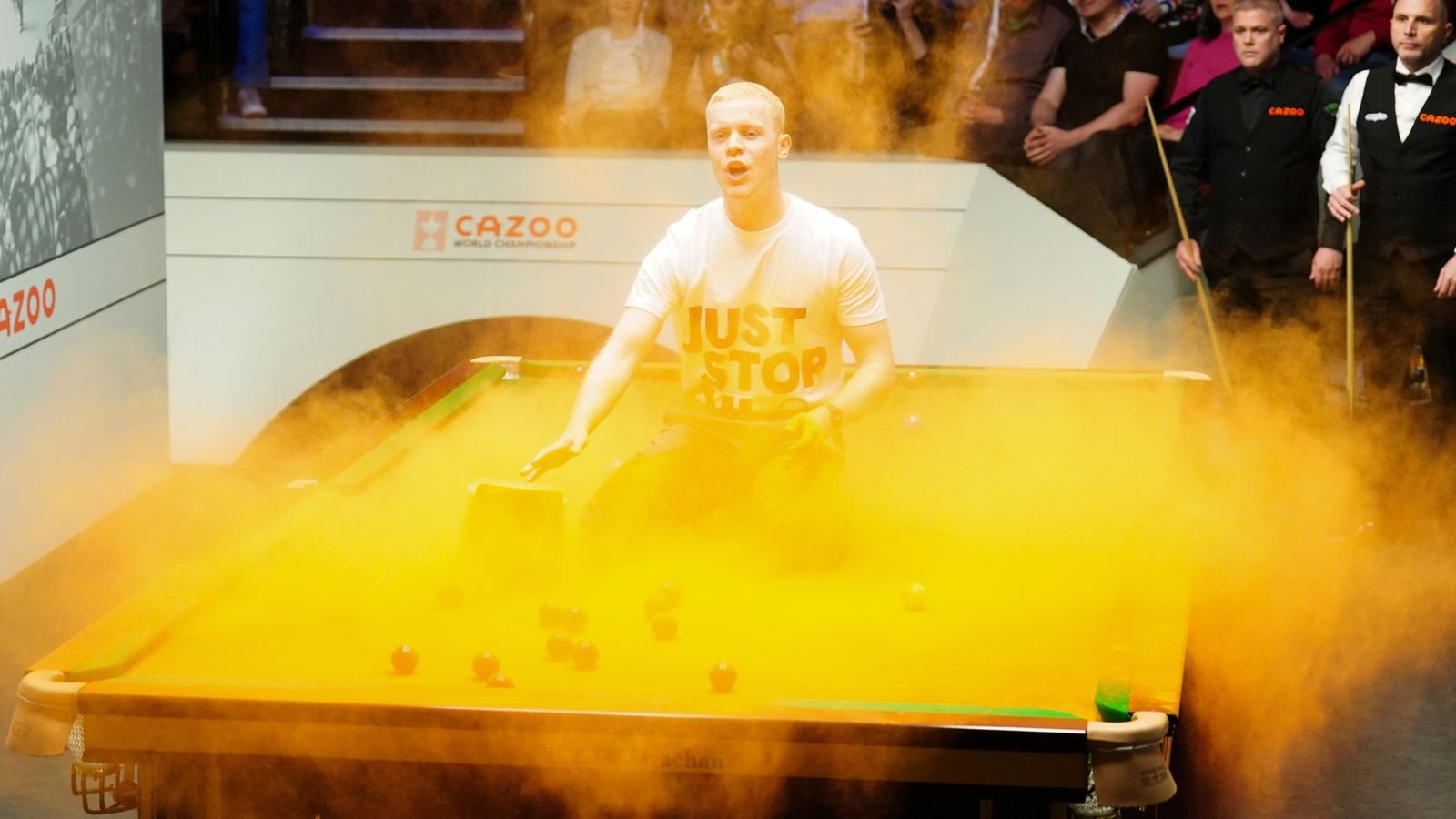 World Snooker Championship: Play suspended as protesters interrupt match and throw orange substance on table