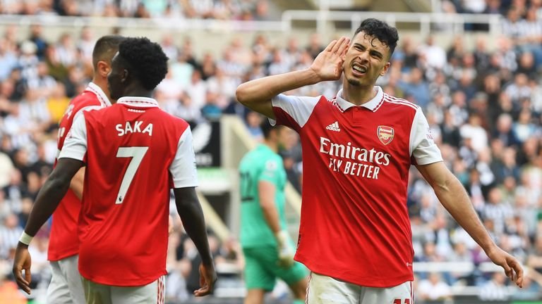 Gabriel Martinelli celebrates after his cross is turned into the Newcastle goal by Fabian Schar