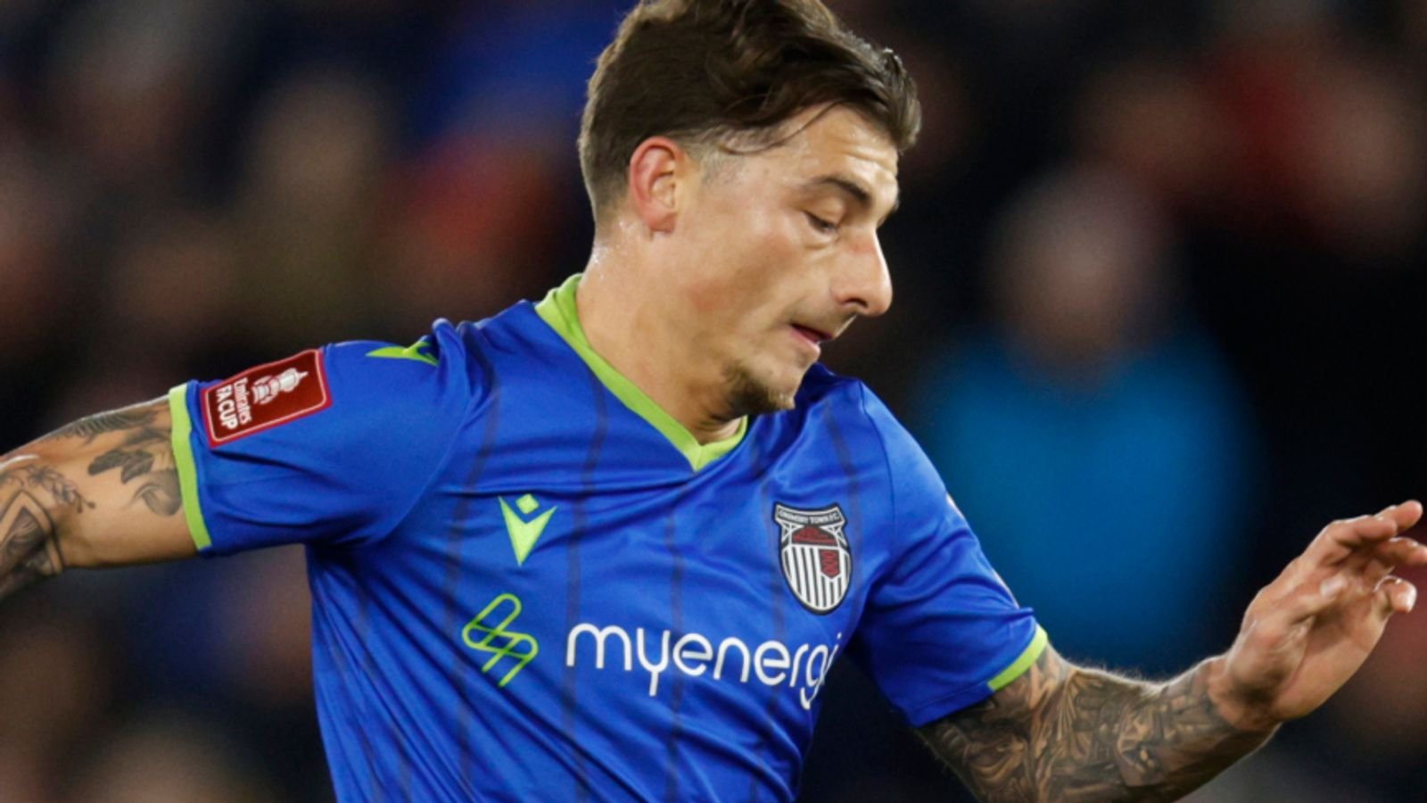 Grimsby's Otis Khan, left, tries to dribble past Southampton's Lyanco during the English FA Cup fifth round soccer match between Southampton and Grimsby Town at St Mary's Stadium in Southampton, England Wednesday, March 1, 2023. (AP Photo/David Cliff)
