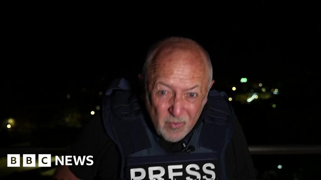 Watch: BBC editor ducks as gunfire interrupts report