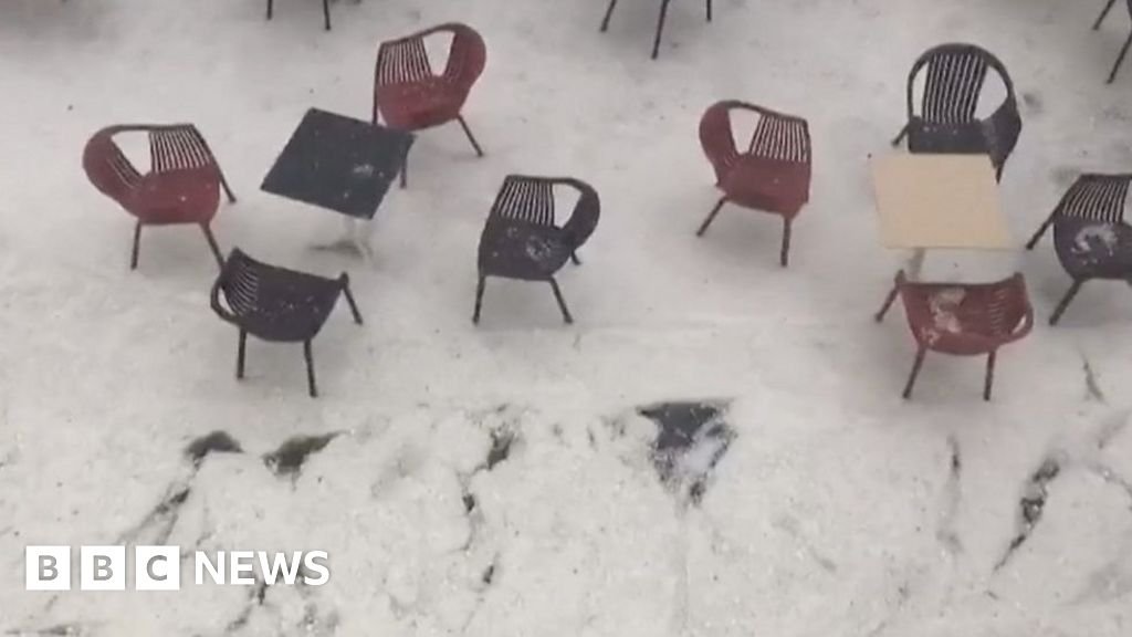 Hail batters Spain and icy water flows through streets