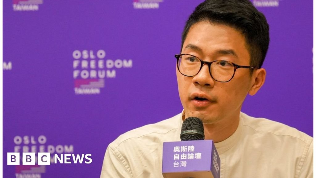 Nathan Law: Police raid family home of exiled Hong Kong activist