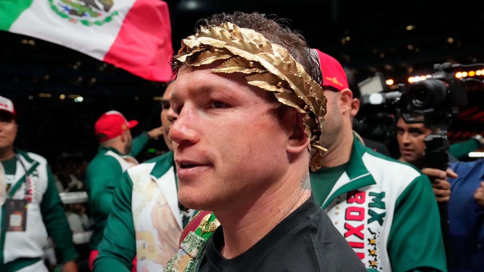 Saul "Canelo" Alvarez of Mexico celebrates after defeating John Ryder of Britain in their super middleweight title boxing match at the Akron Stadium in Guadalajara, Mexico, Saturday, May 6, 2023. (AP Photo/Moises Castillo)