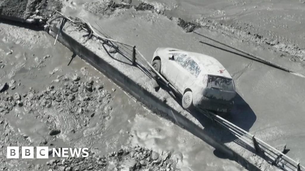 Muddy floodwater rips through Italian town's riverbank