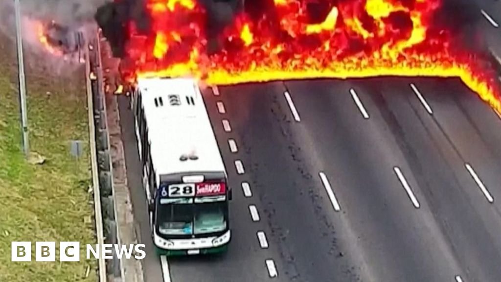 Watch moment passengers flee after bus catches fire