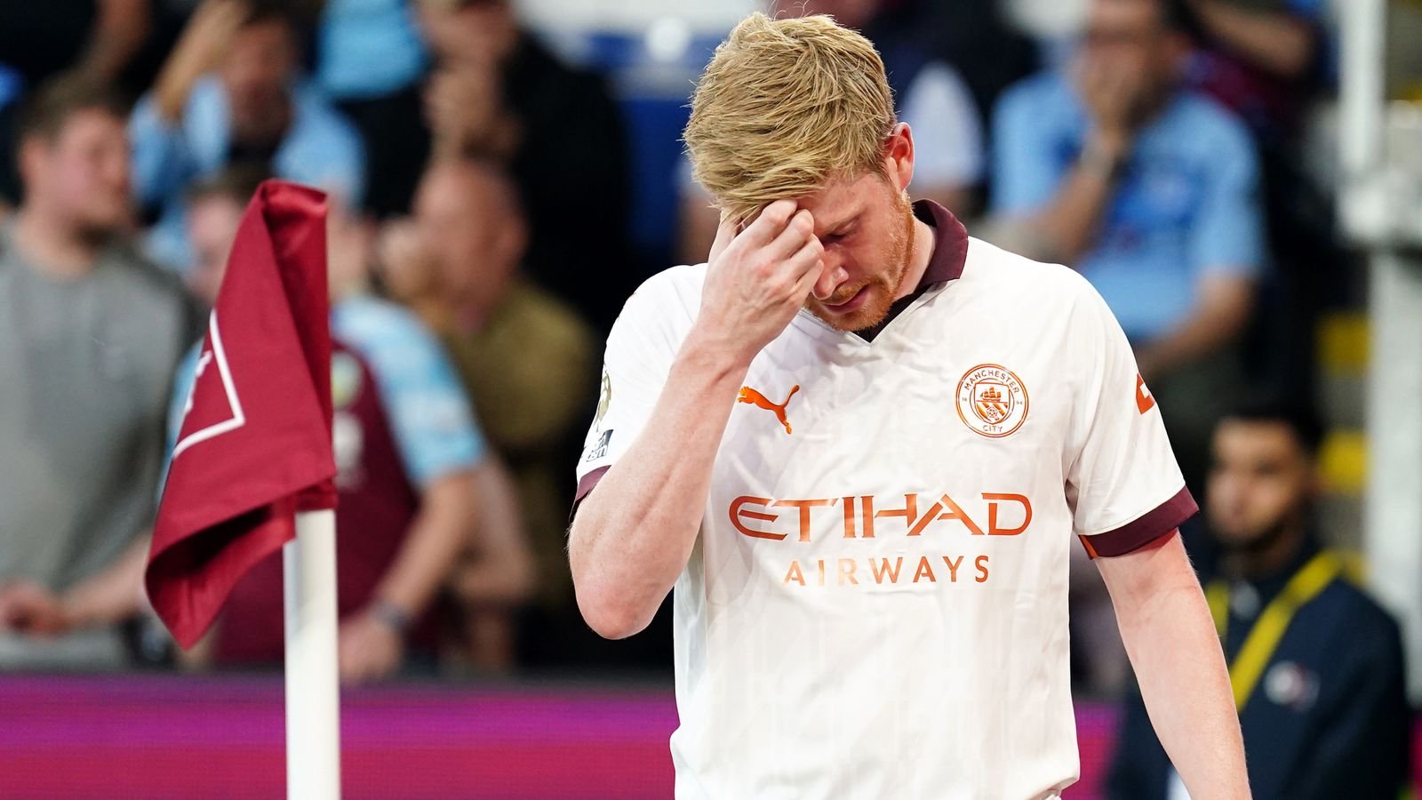 Kevin De Bruyne appears dejected after being substituted for an injury