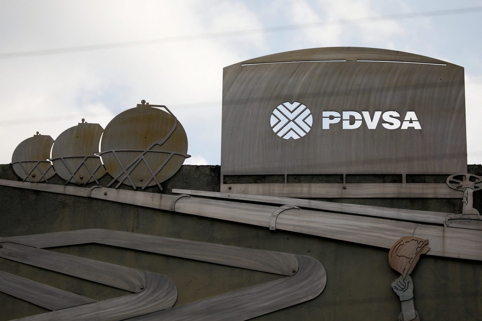 FILE PHOTO: Cutouts depicting images of oil operations are seen outside a building of Venezuela